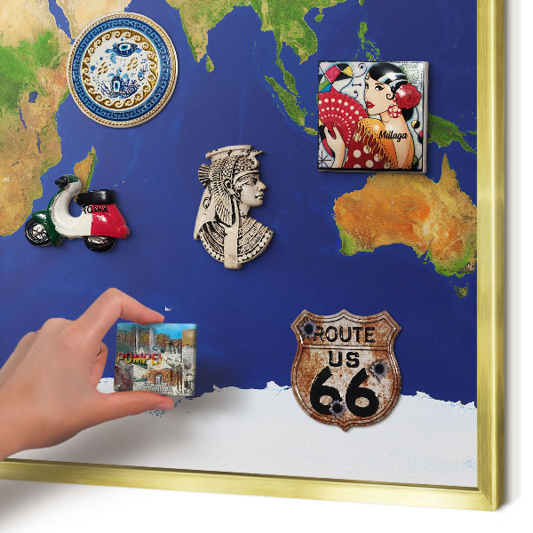 Metal magnet board with a gold frame Mapping the globe
