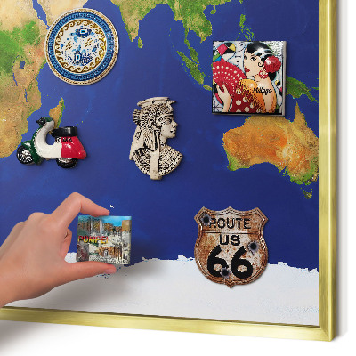 Metal magnet board with a gold frame Mapping the globe