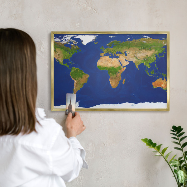 Metal magnet board with a gold frame Mapping the globe