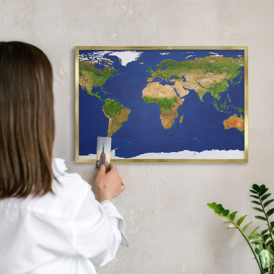 Metal magnet board with a gold frame Mapping the globe