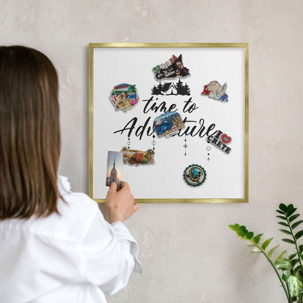 Magnetic board for magnets in a gold frame Adventure awaits