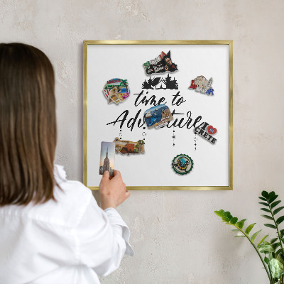 Magnetic board for magnets in a gold frame Adventure awaits
