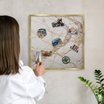 Metal magnet board with a gold frame Marble elegance