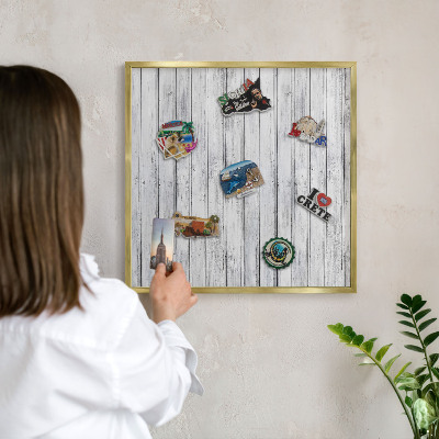 Magnetic board for magnets in a gold frame Light wood