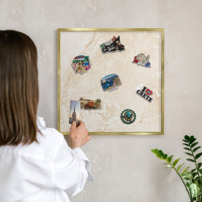 Metal magnet board with a gold frame Delicate marble