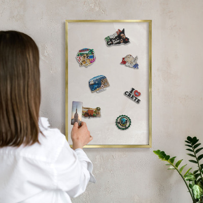 Metal magnet board with a gold frame Creamy texture