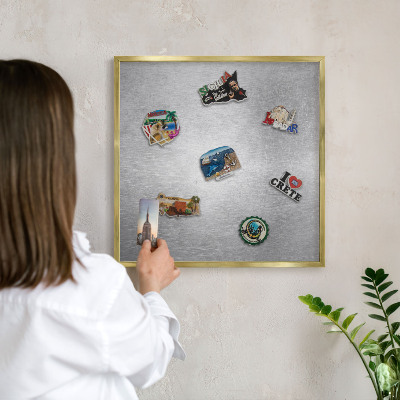 Metal magnet board with a gold frame Metallic surface