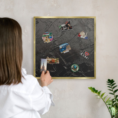 Metal magnet board with a gold frame Textured black