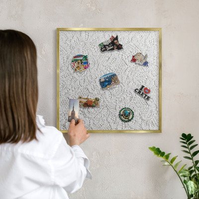 Magnetic board for magnets in a gold frame Openwork elegance