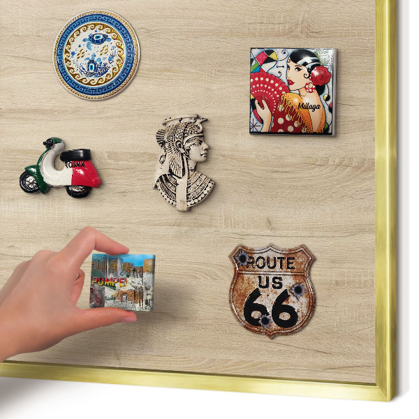 Metal magnet board with a gold frame Wooden background