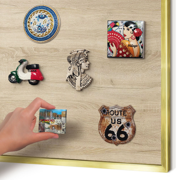 Metal magnet board with a gold frame Wooden background