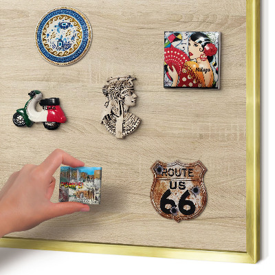 Metal magnet board with a gold frame Wooden background