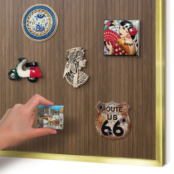 Magnetic board for magnets in a gold frame Wooden background