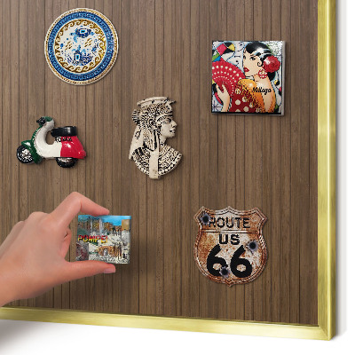 Magnetic board for magnets in a gold frame Wooden background