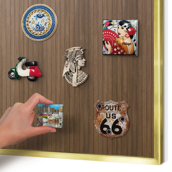 Magnetic board for magnets in a gold frame Wooden background