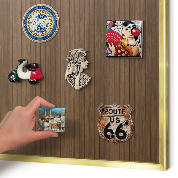 Magnetic board for magnets in a gold frame Wooden background
