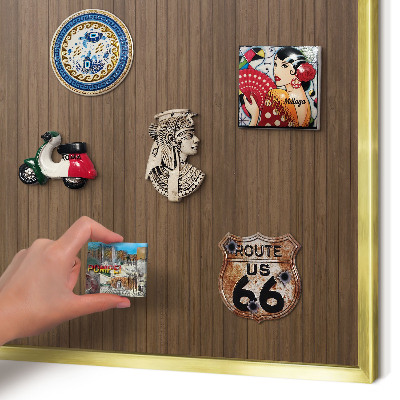 Magnetic board for magnets in a gold frame Wooden background