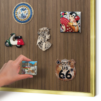 Magnetic board for magnets in a gold frame Wooden background