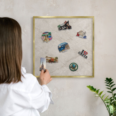 Magnetic board for magnets in a gold frame Natural elegance