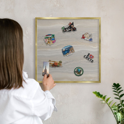 Metal magnet board with a gold frame Marble texture