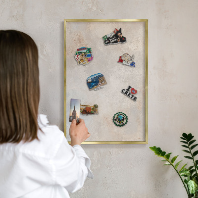Metal magnet board with a gold frame Neutral background