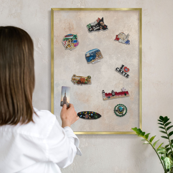 Metal magnet board with a gold frame Neutral background
