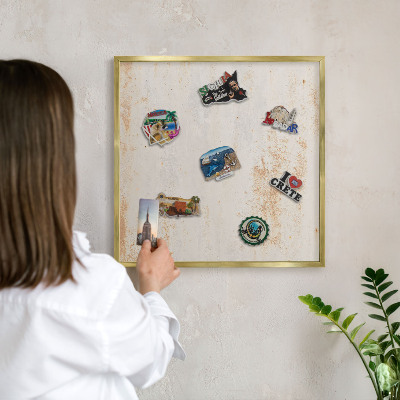 Magnetic board for magnets in a gold frame Rusty texture