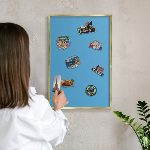 Metal magnet board with a gold frame Blue water