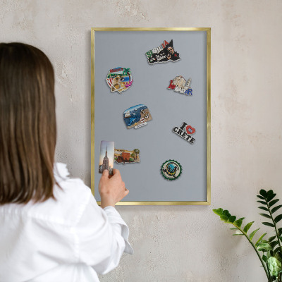 Metal magnet board with a gold frame Delicate gray
